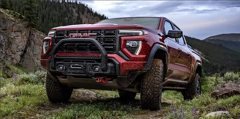 A red 2025 GMC Canyon off-roading.