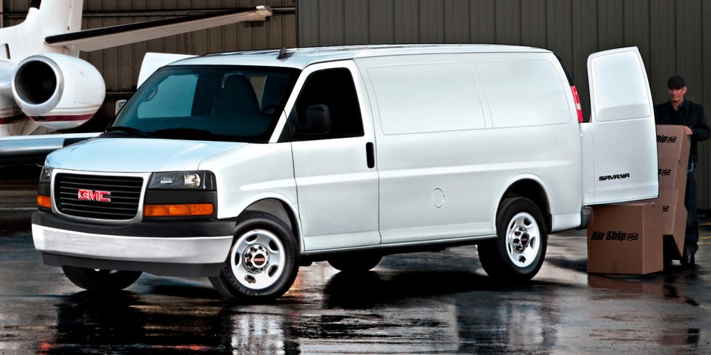 White 2026 GMC Savana Cargo Van in his front side profile